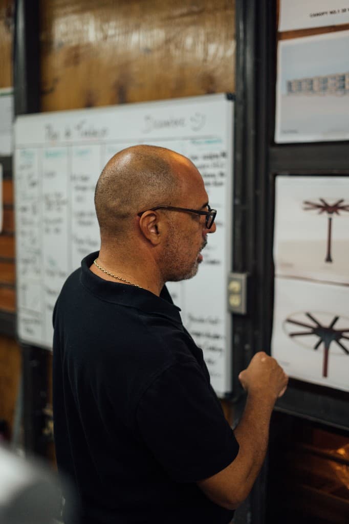 Benitez Metal team member reviewing project plans